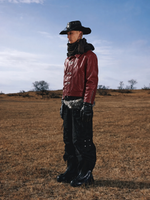Maroon leather jacket, side view with toggle closures and relaxed shoulder fit