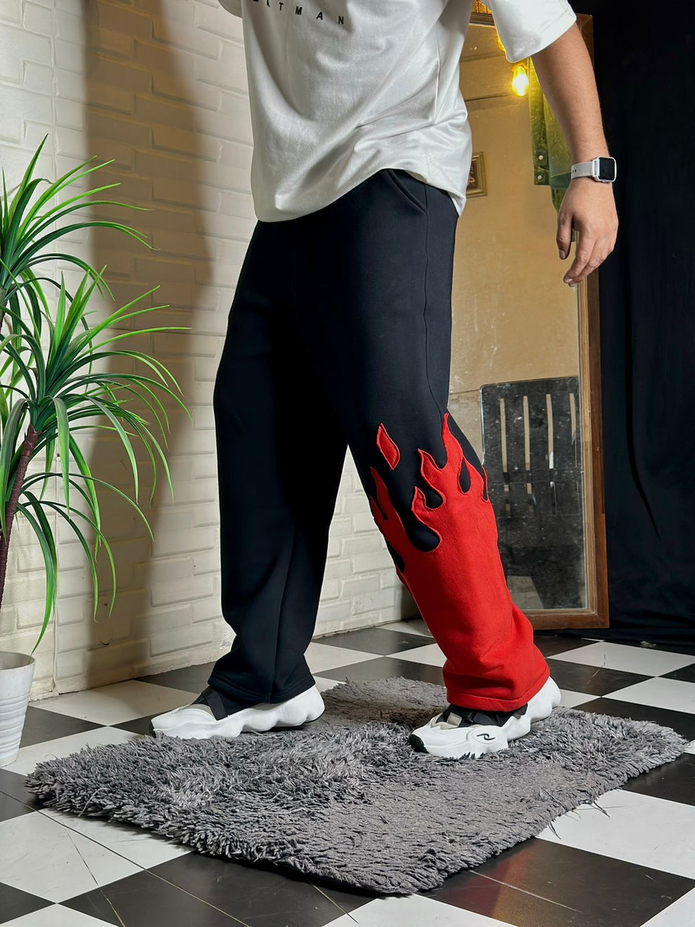 Side view of fire kick bottom pants with flame detail