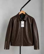 Brown leather slim-fit jacket with full-zip front, stand collar, zip pockets