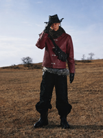 Maroon leather jacket with front toggle clasp, pointed collar, long sleeves