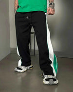 Green and white wide-leg track pants by Xoratic