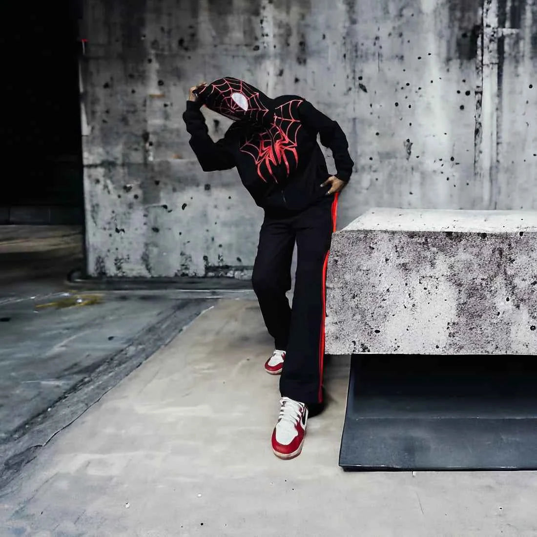 Black spider-inspired hoodie by Xoratic