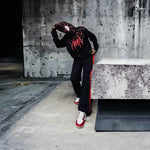 Black spider-inspired hoodie by Xoratic