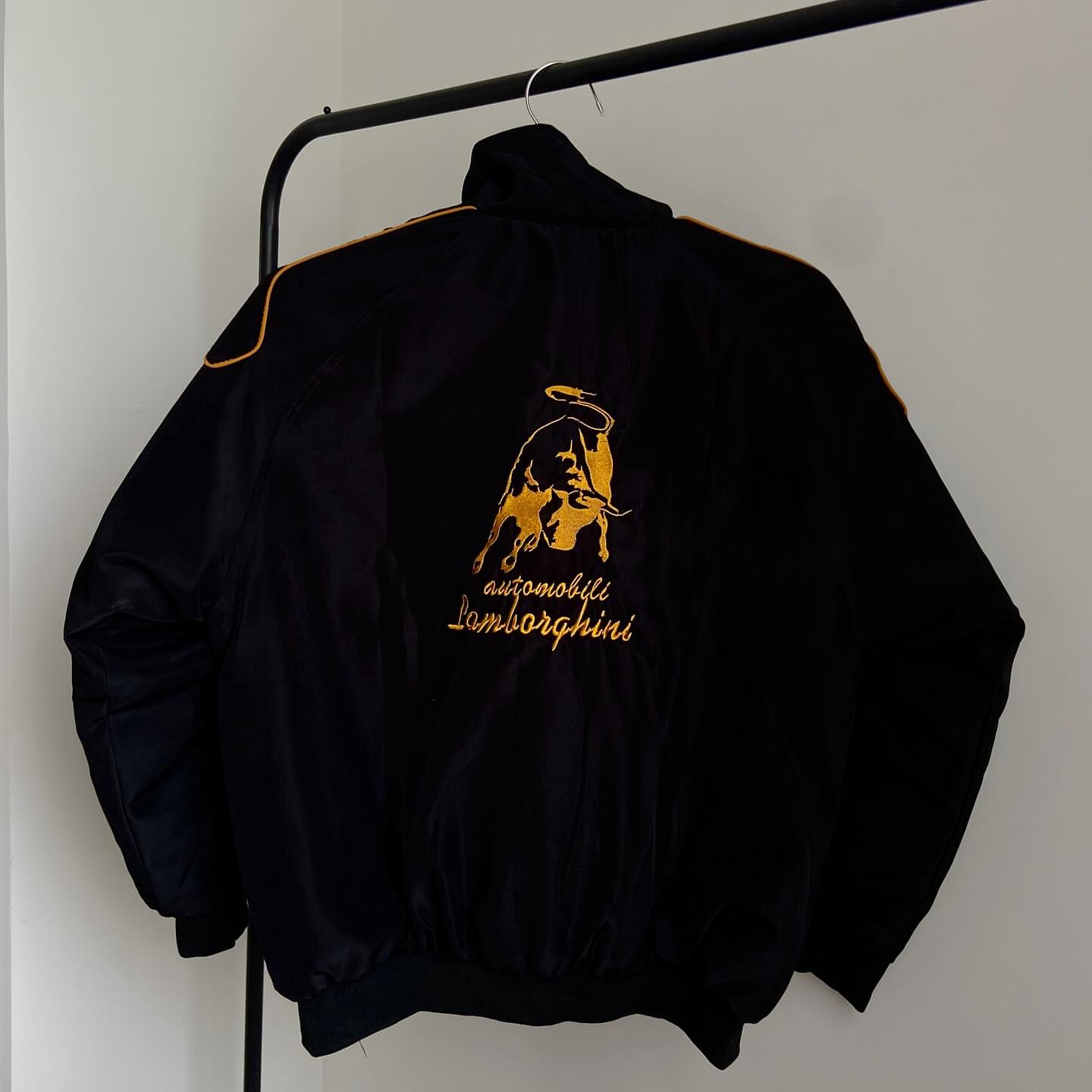 This is Embroidered lamborghini racing jacket in black for unisex.