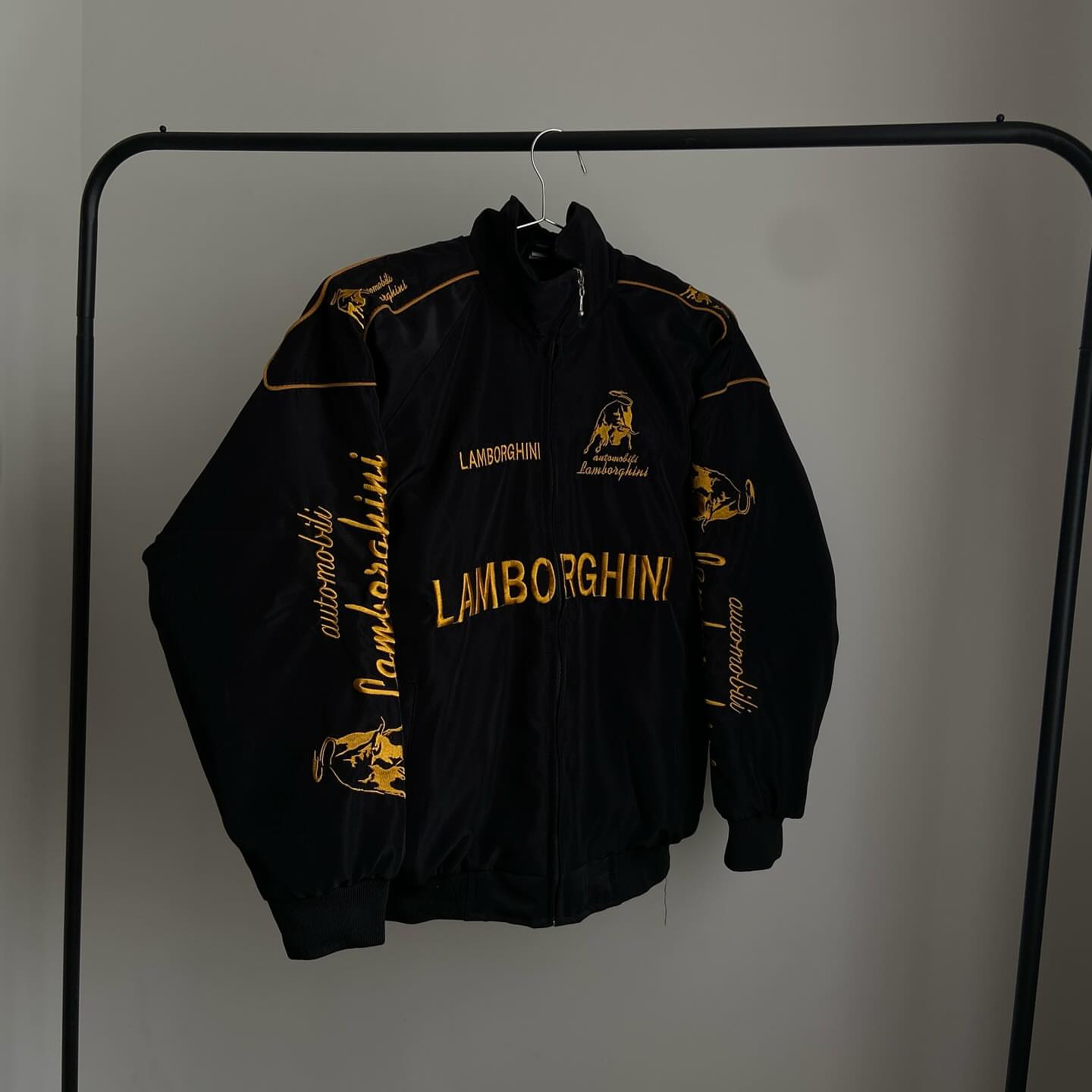 This is Embroidered lamborghini racing jacket in black for unisex.