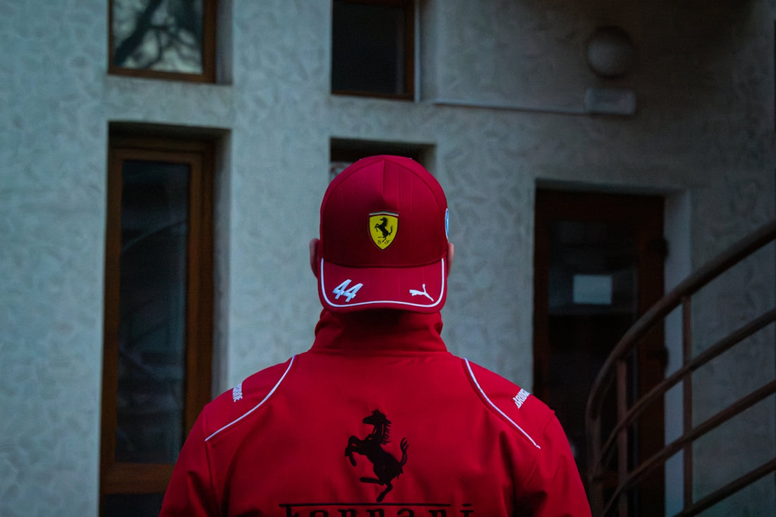 Man wearing a red ferrari hat and jacket.