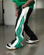 Green and white wide-leg track pants by Xoratic