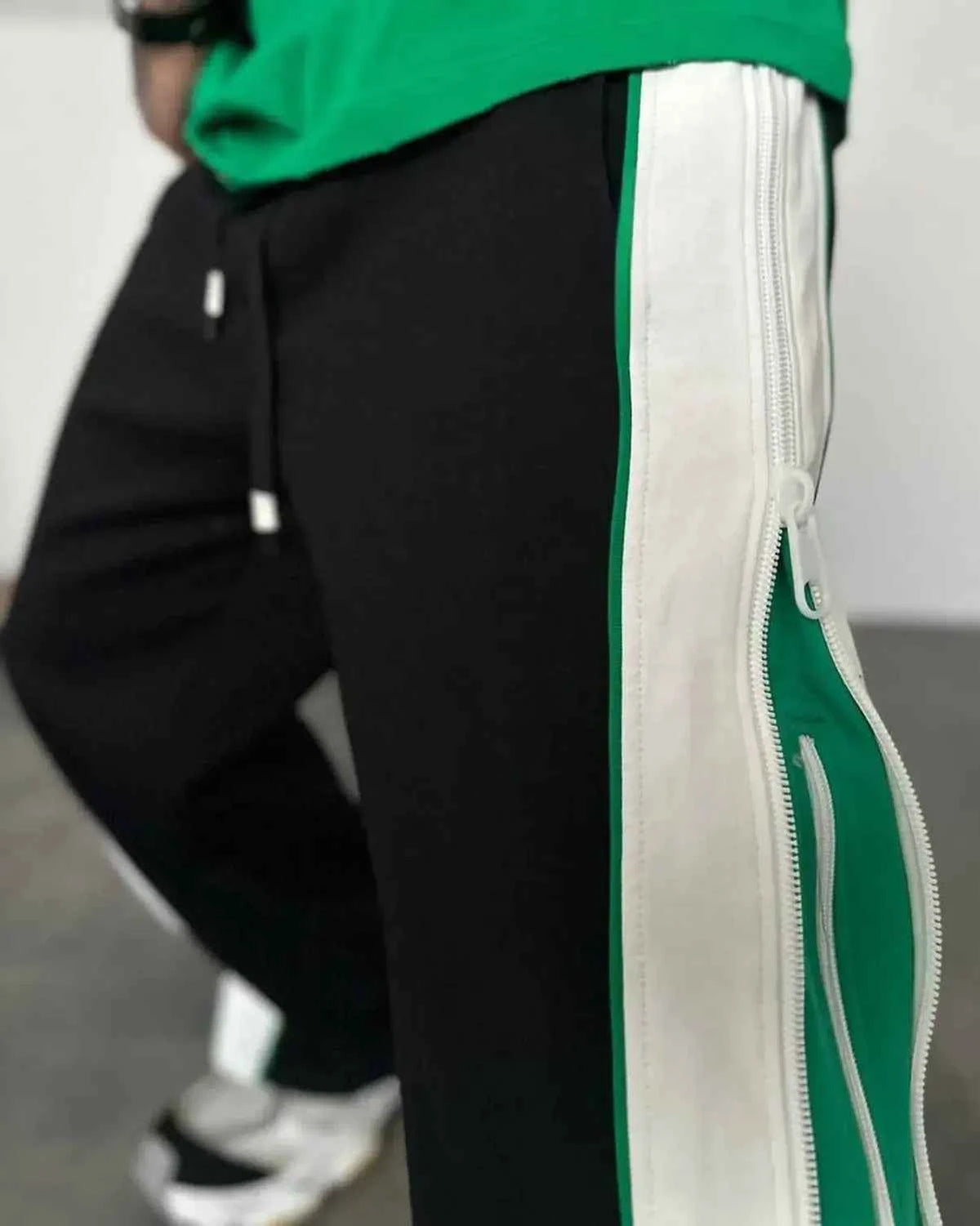 Green and white wide-leg track pants by Xoratic