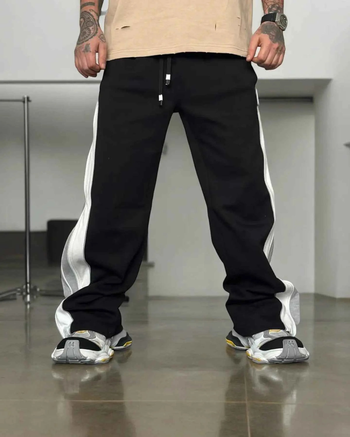 Black zip up jogger pants by Xoratic