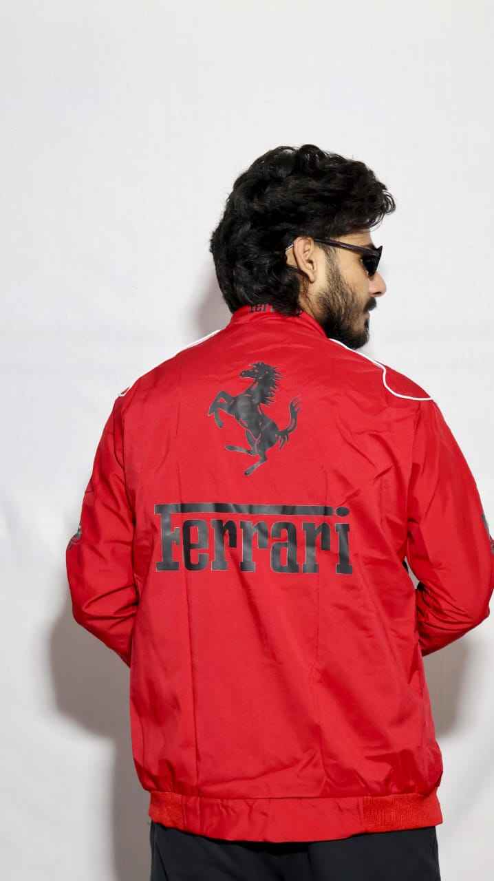 Elevate Your Look with the Ferrari Racing Jacket in Bold Red worn by a man showing the iconic Ferrari logo and prancing horse design on the back by Xoratic