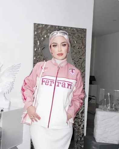 Chic Pink Ferrari Racing Jacket for Girls - Embroidered & Stylish by Xoratic, modeled with white trousers and a matching headscarf