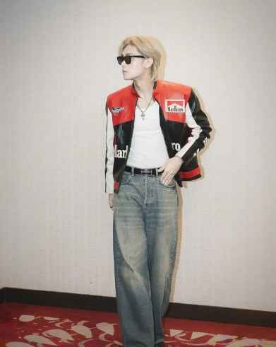 Marlboro Racing Embroidered Jacket: Elevate Your Wardrobe with Timeless Style worn by a model with sunglasses, jeans, and a white top from Xoratic