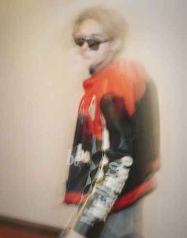 Marlboro Racing Embroidered Jacket: Elevate Your Wardrobe with Timeless Style by Xoratic, red and black embroidered jacket worn with sunglasses