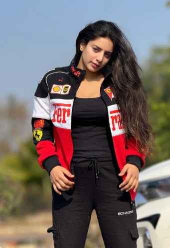 Ferrari Racing Jacket: Elevate Your Style with Tri-Colored Elegance worn by a woman outdoors, featuring red, black, and white racing details from Xoratic