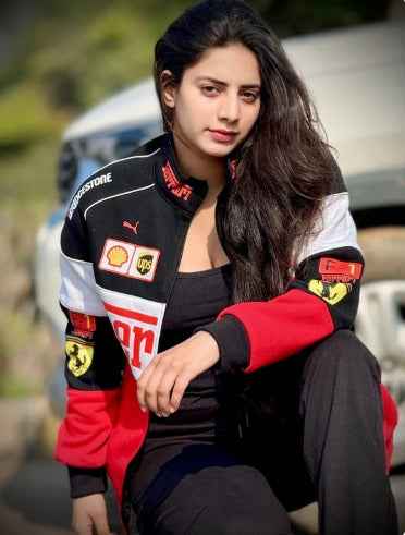Ferrari Racing Jacket: Elevate Your Style with Tri-Colored Elegance worn by a woman in a black, red, and white motorsport jacket with racing patches