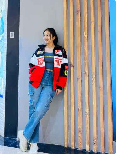 Ferrari Racing Jacket: Elevate Your Style with Tri-Colored Elegance by Xoratic, worn by a smiling woman with jeans in a stylish indoor setting