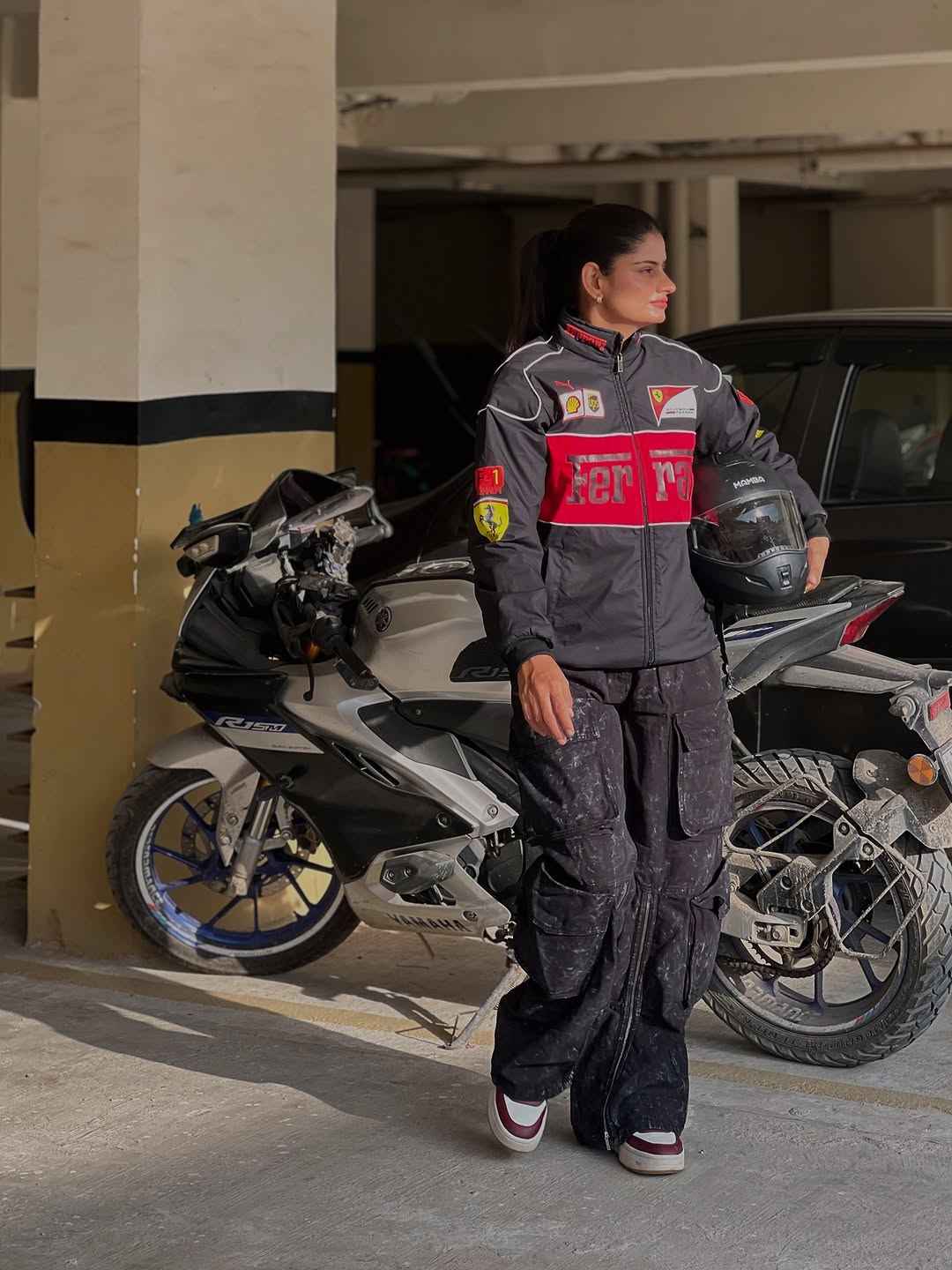 Ferrari Racing Jacket Combo - Embrace Style and Performance by Xoratic from Combo Offers, featuring a rider in a black and red jacket beside a motorcycle