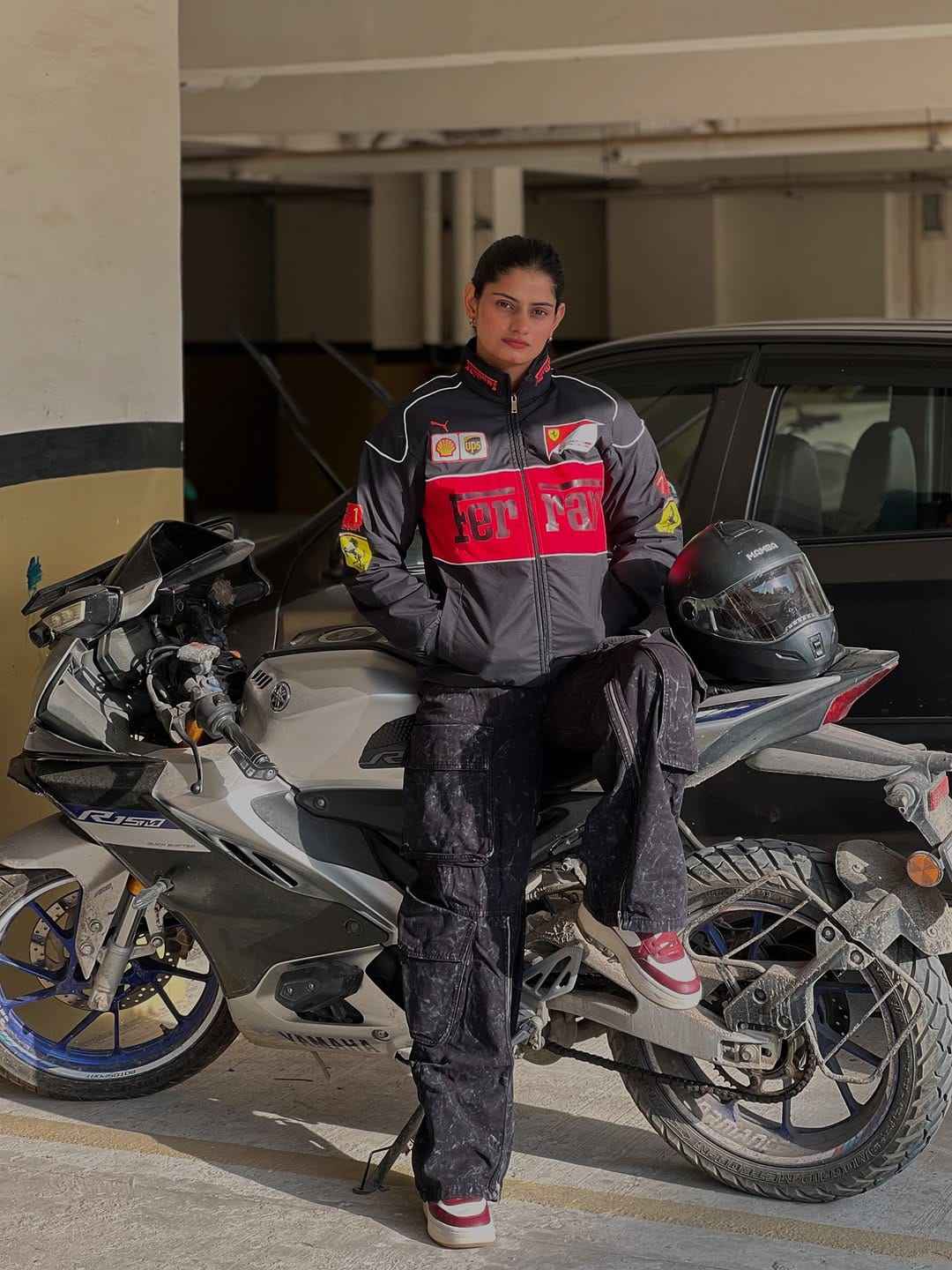 Ferrari Racing Jacket Combo - Embrace Style and Performance by Xoratic from Combo Offers, featuring a rider in a racing jacket seated on a sport motorcycle