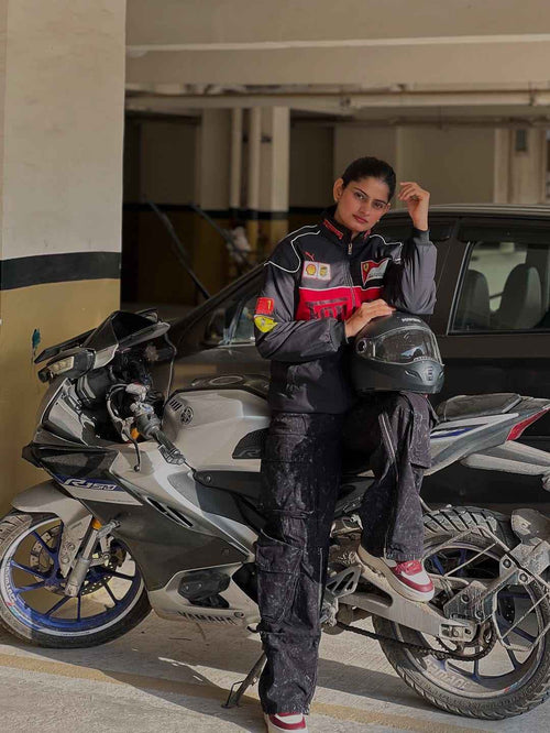 Black Ferrari Racing Jacket - Elevate Your Style and Showcase Your Passion, modeled by a rider seated on a sport motorcycle with helmet